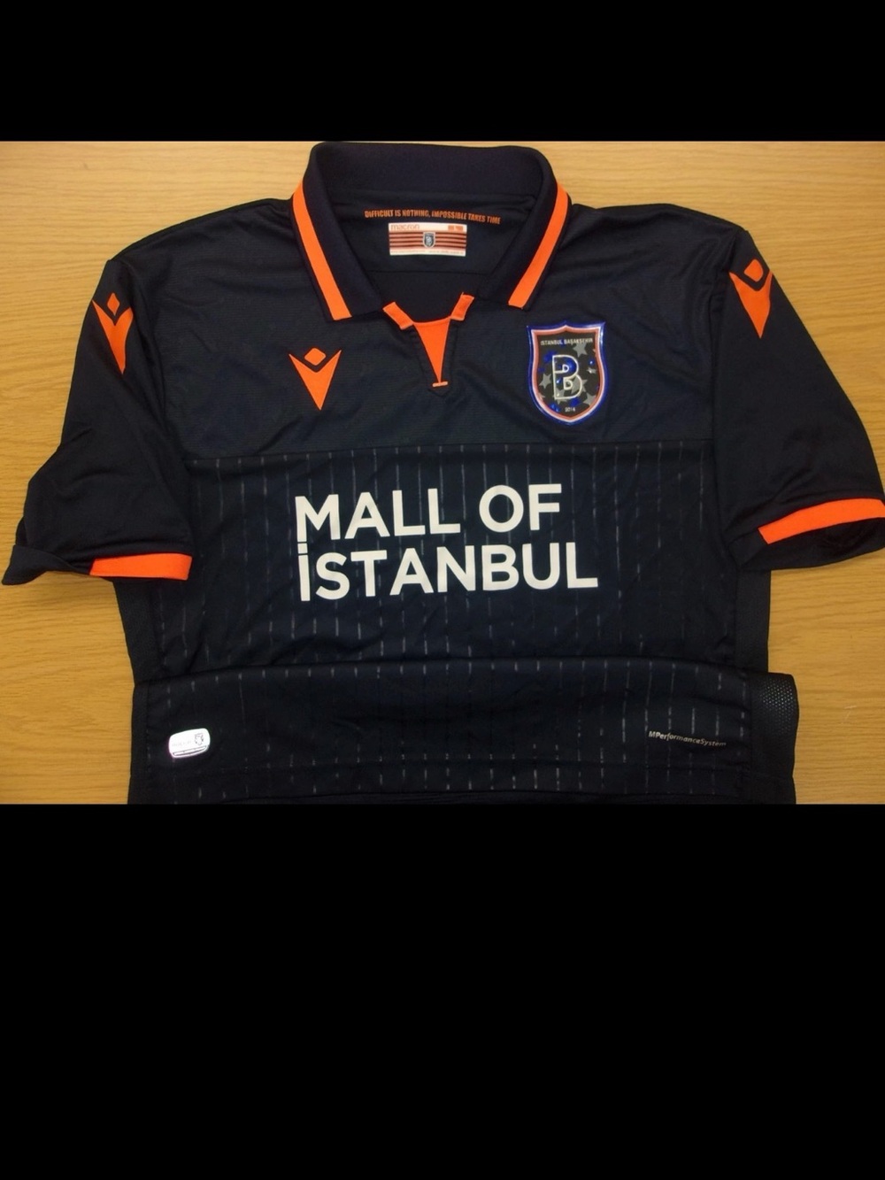 MACRON  Black and Orange Club Football Shirt